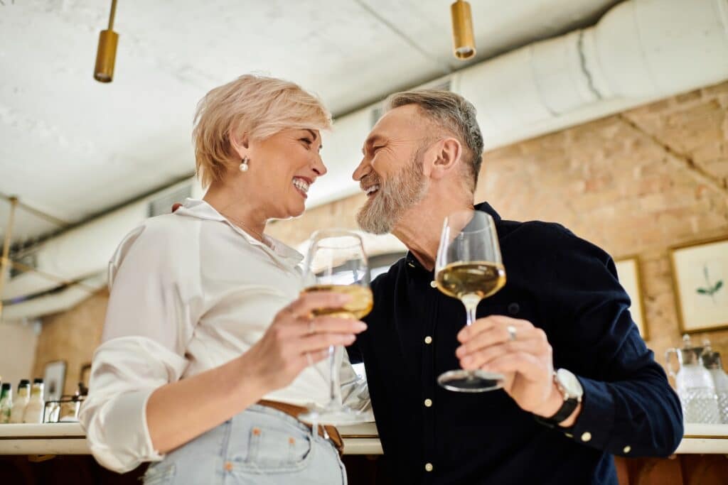 middle aged couple enjoying a glass of wine on one of the best Virginia getaways for wine lovers