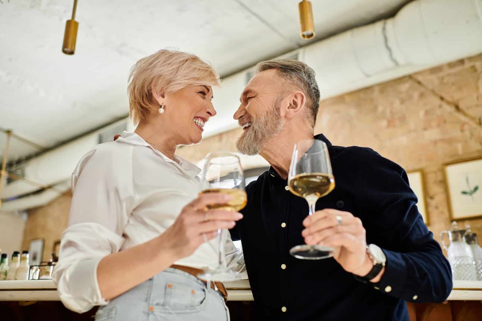 One of the Best Virginia Getaways for Wine Lovers 1 middle aged couple enjoying a glass of wine on one of the best Virginia getaways for wine lovers