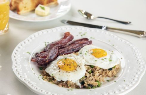 Southern specialty eggs easy up with rice and bacon