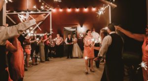 Wedding reception in lighted red barn venue